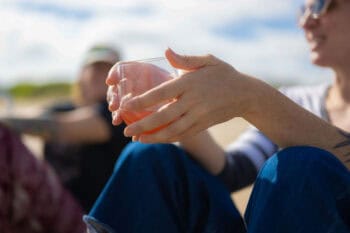 ADHD in Marriage: EFT vs Gottman Therapy Approaches - couple on beach showing hands