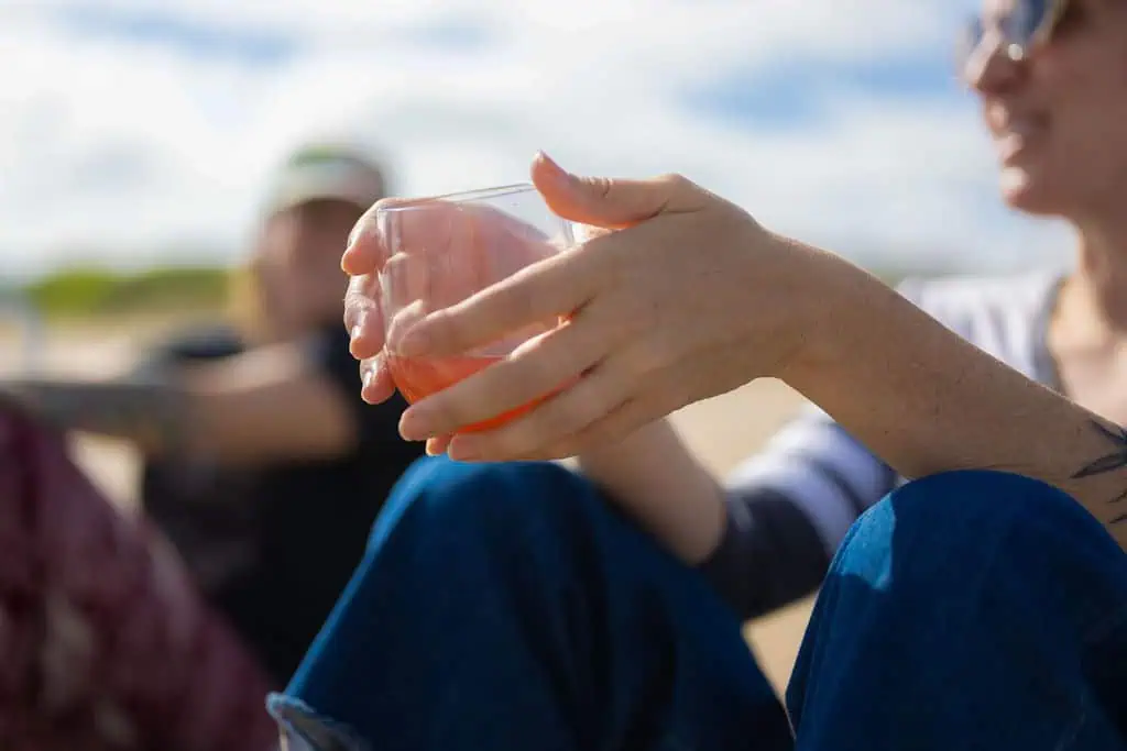 ADHD in Marriage: EFT vs Gottman Therapy Approaches - couple on beach showing hands