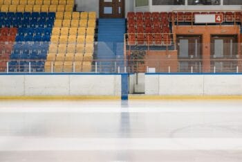 Empty ice hockey rink evoking Heated Rivalry's mental health themes of isolation